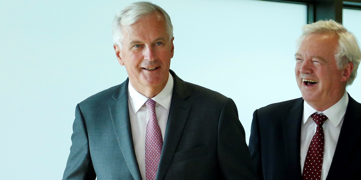 Britain's Secretary of State for Exiting the European Union David Davis (R) and European Union's chief Brexit negotiator Michel Barnier arrive for Brexit talks in Brussels, Belgium August 28, 2017.