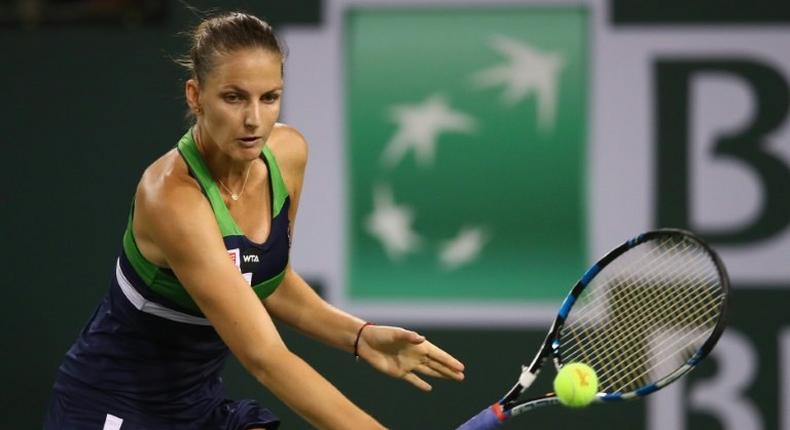 Karolina Pliskova of the Czech Republic plays a backhand against Garbine Muguruza of Spain on her way to a 7-6 (7/2), 7-6 (7/5) quarter final win at Indian Wells