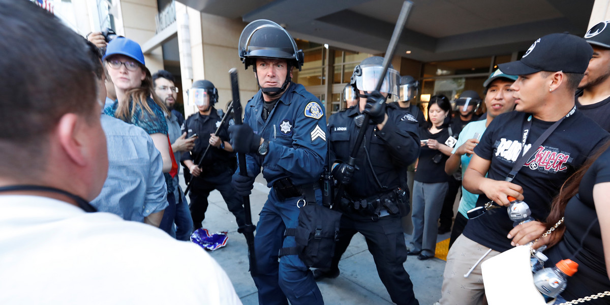 Police officers moved in on a group of protesters after a campaign rally for Republican US presidential candidate Donald Trump in San Jose, California, on Thursday.