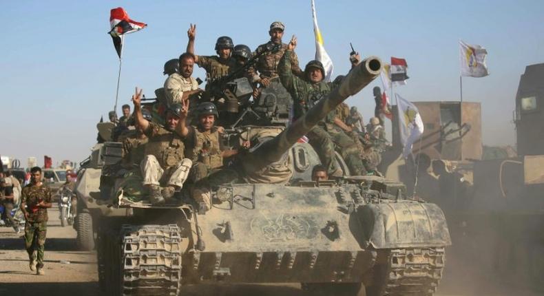 Iraqi government forces and Abbas Brigade fighters of the Hashed al-Shaabi paramilitary group advance towards the city of Tal Afar, the main remaining bastion of the Islamic State group in the country's north