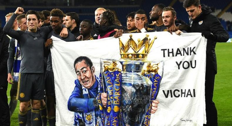 Leicester players hold a banner in honour of late owner Vichai Srivaddhanaprabha after their Premier League win against Cardiff