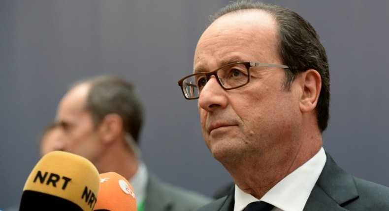 France's President Francois Hollande addresses journalists as he arrives for an European Union leaders summit, at the European Council in Brussels, on October 20, 2016