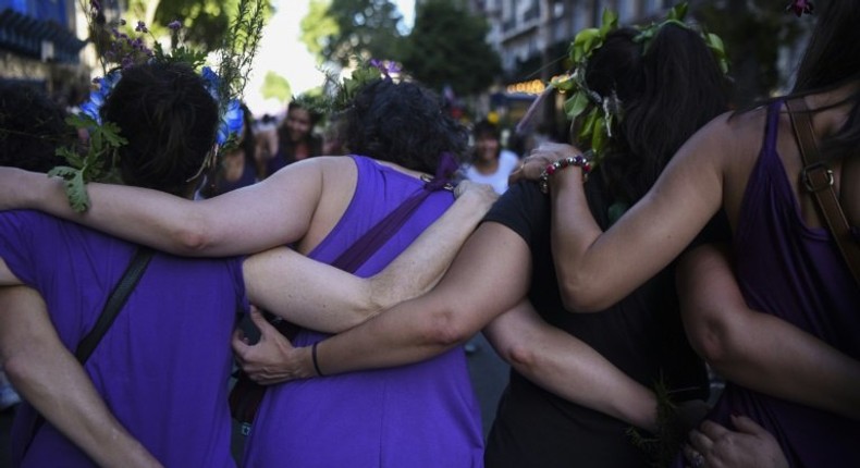 Activists march during the commemoration of the International Day for the Elimination of Violence Against Women in Buenos Aires on November 25, 2016, with other marches planned in Chile, Uruguay, Colombia, Venezuela, Guatemala and Peru