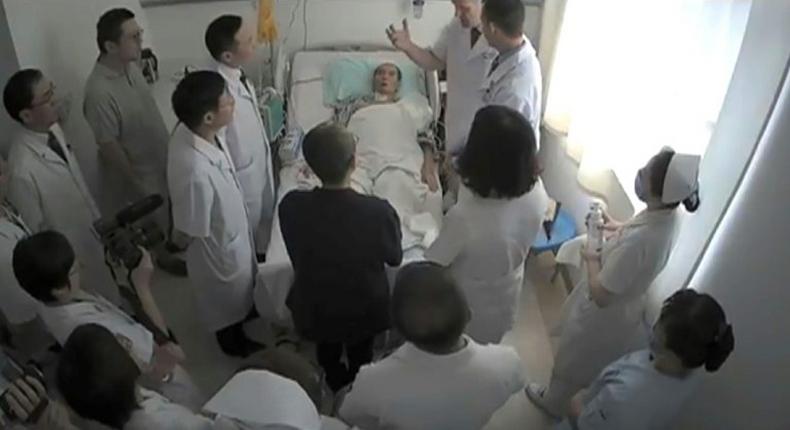 This undated video grab obtained July 11, 2017 shows Chinese Nobel Laureate Liu Xiaobo surrounded by doctors and his wife Liu Xia at an undisclosed location. The US government has expressed concern about the cancer-stricken democracy activist