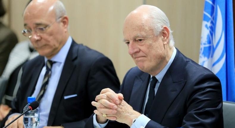 UN Special Envoy for Syria Staffan de Mistura (R) attends a meeting of Intra-Syria peace talks with Syrian government delegation at the Palais des Nations in Geneva on February 25, 2017