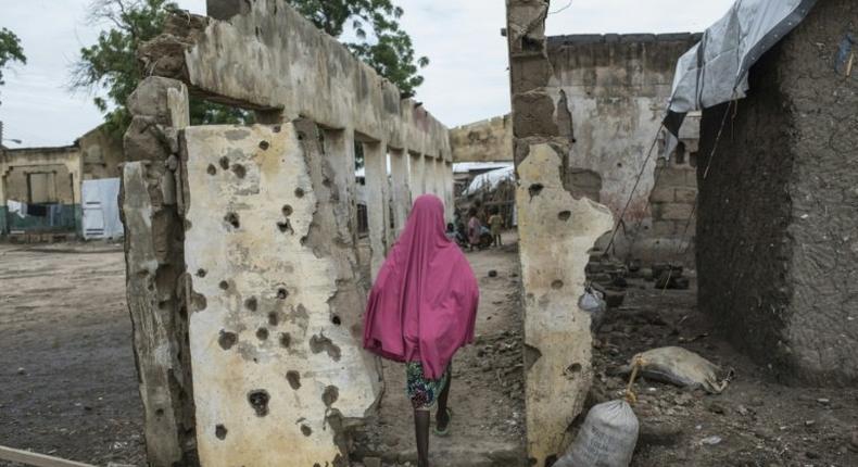 A girl walking through the Rann internally displaced persons camp in northeastern Nigeria after the January 2017 bombing by the Nigerian military that killed 112 civilians