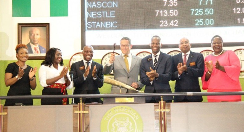 Mr. Quest beating the gong alongside the Executive Director, Market Operations and Technology, NSE, Ade Bajomo; the Chief Executive Officer, NSE, Oscar Onyema; and the Supervising Producer – Africa, CNN, Stephanie Busari.