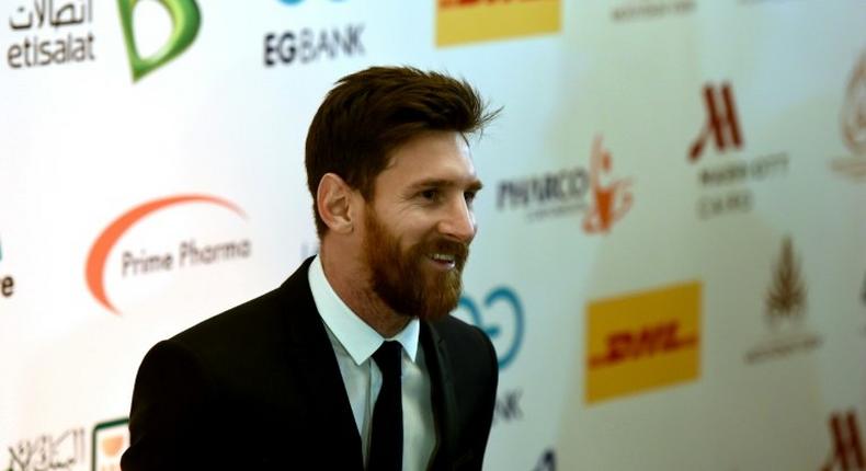 Barcelona's striker Lionel Messi arrives for a press conference in Cairo's northern Giza district on February 21, 2017