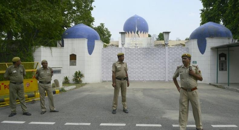 Indian policemen stand guard outside the High Commission for Pakistan in New Delhi