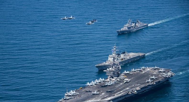 Earlier this month naval exercises were conducted in the Sea of Japan (East Sea) by the aircraft carrier USS Carl Vinson (pictured), with South Korean and Japanese aircraft also taking part