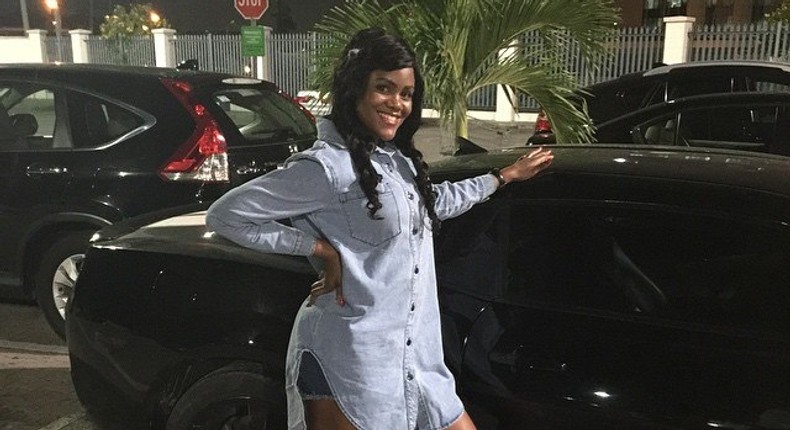 Busola Dakolo sports a boyfriend shirt over shorts and high top sneakers