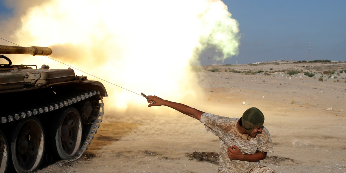 A fighter of Libyan forces allied with the UN-backed government firing a shell with a Soviet-made T-55 tank at Islamic State fighters in Sirte, Libya, on August 2.