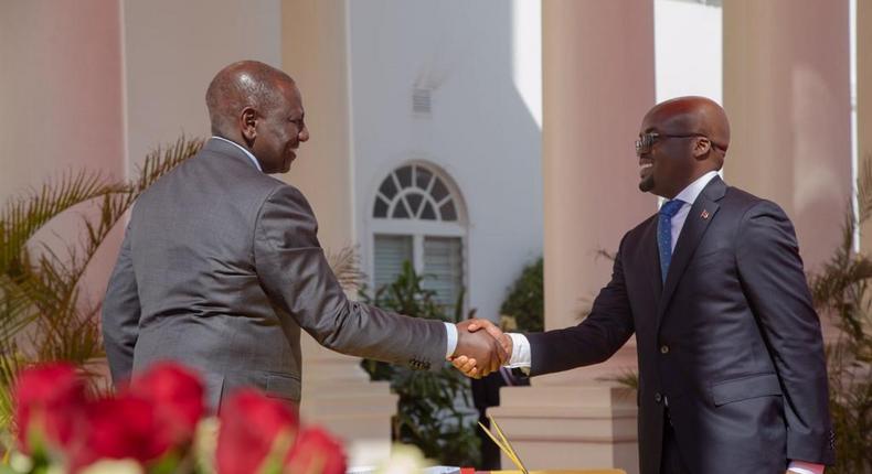President William Ruto with Dr Raymond Ojwang Omollo after being sworn in a Interior PS at State House on Friday, December 2, 2022
