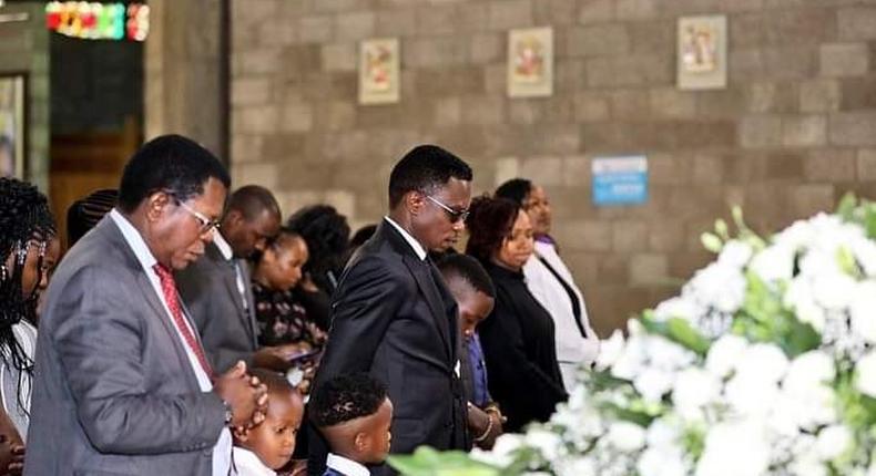 Sports CS Ababu Namwamba and his family at Consolata Shrine during the requiem mass of Prisca Mwaro