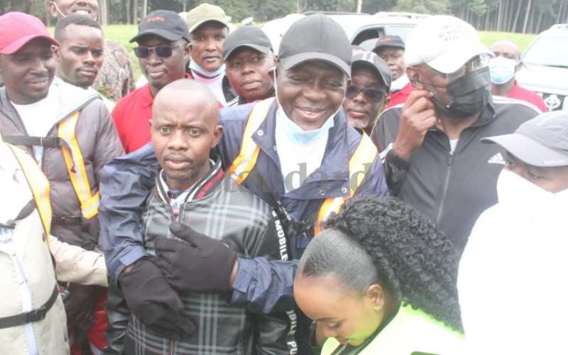 Jubilee Party Secretary General Raphael Tuju with matatu driver Bernard Muya Njuguna