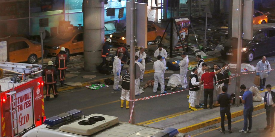 Forensic experts work outside Turkey's largest airport, Istanbul Ataturk, Turkey, following a blast, June 28, 2016.