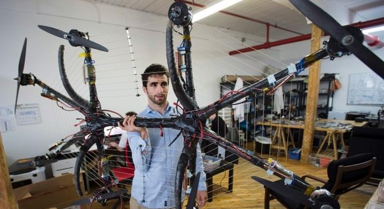 Duru, with his record breaking hoverboard modeled from a drone