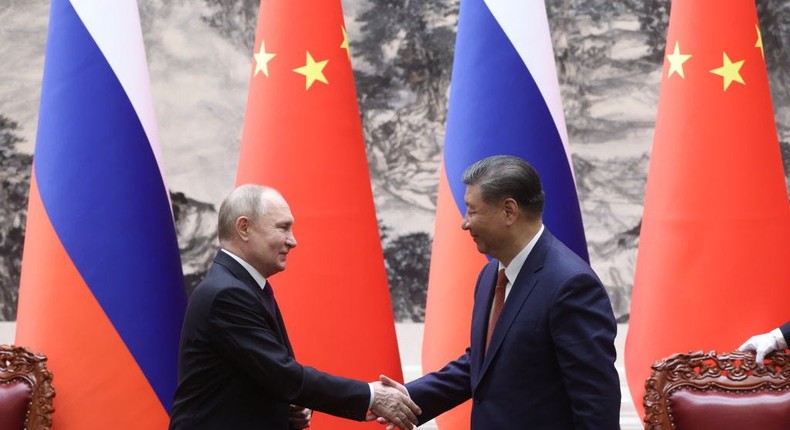 Russian President Vladimir Putin and China's leader Xi Jinping shake hands during a bilateral meeting in Beijing, China.Contributor/Getty Images