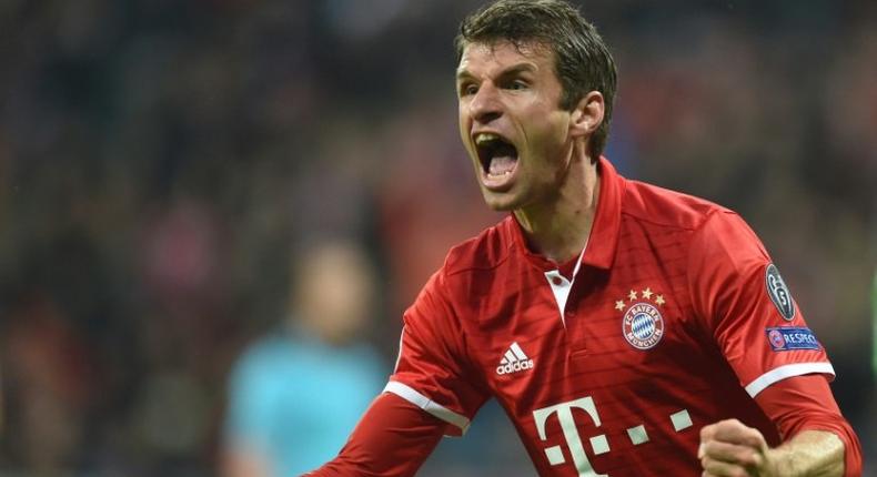 Bayern Munich's striker Thomas Mueller celebrates after the first goal during the UEFA Champions League group D football match FC Bayern Munich vs PSV Eindhoven in Munich, on October 19, 2016