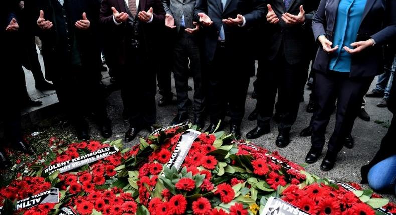 Mayors of the main opposition Peoples Republic Party (CHP) pray after laying wreaths in front of the Reina nightclub in Istanbul on January 4, 2017, three days after a gunman killed 39 people there on New Year's eve