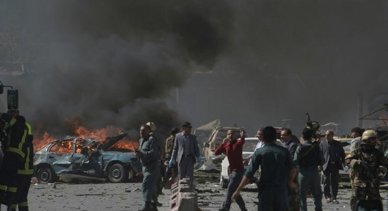 Afghan security forces personnel at the site of a car bomb attack in Kabul on May 31, 2017