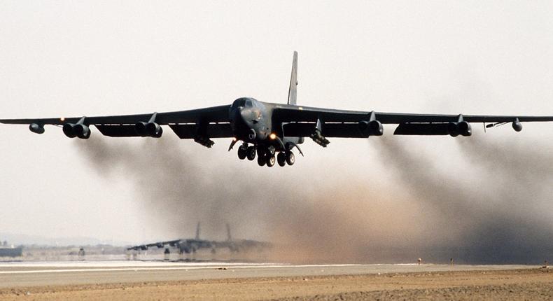 A B-52G Stratofortress bomber aircraft taking off from a runway.