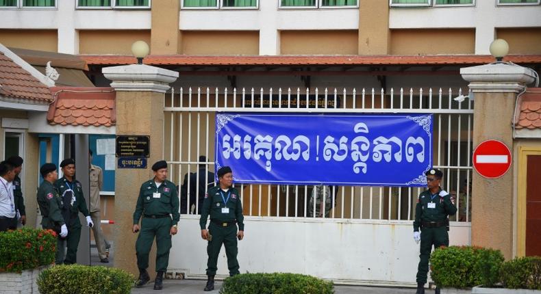 Police officers surrounded Phnom Penh Court on Wednesday as Cambodian opposition leader Kem Sokha arrived for his treason trial