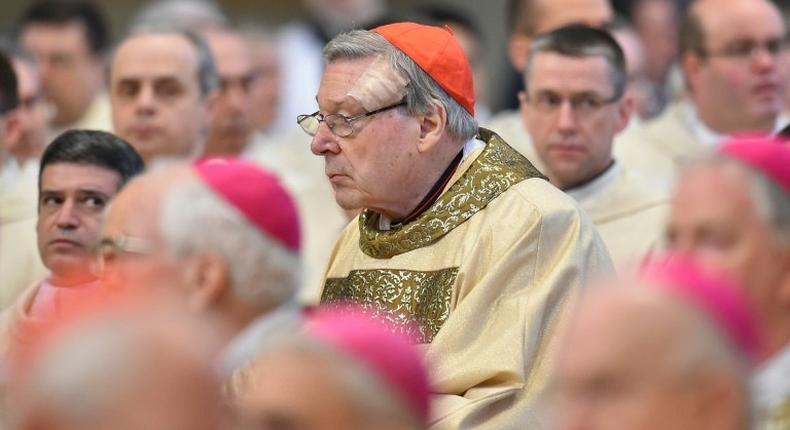 Vatican finance chief, Australian Cardinal George Pell (C) attends a mass for the ordination of new bishops, at St Peter's basilica, on March 19, 2016