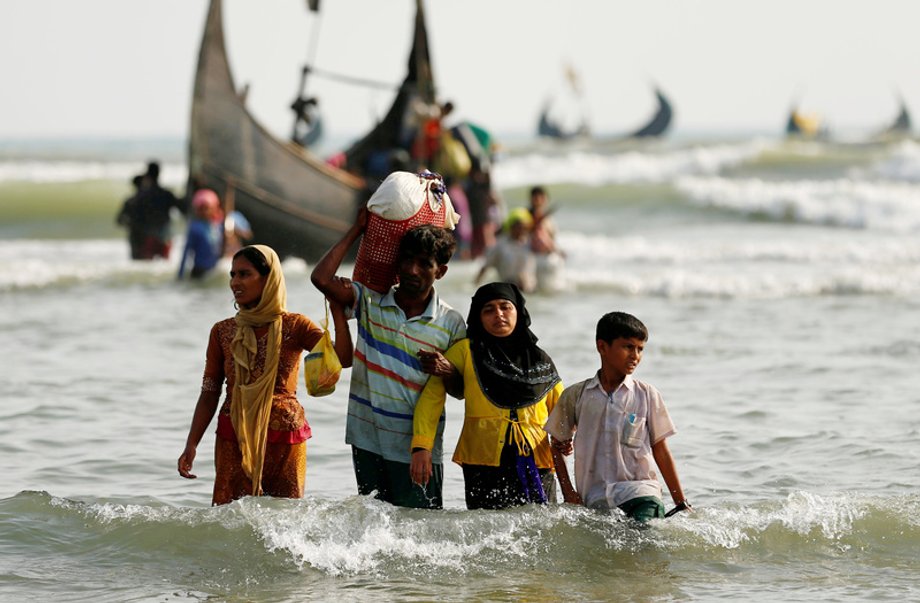 Rohingya refugees cross the Bangladesh-Myanmar border by boat at Teknaf. Many Rohingya have drowned while making such water crossings.