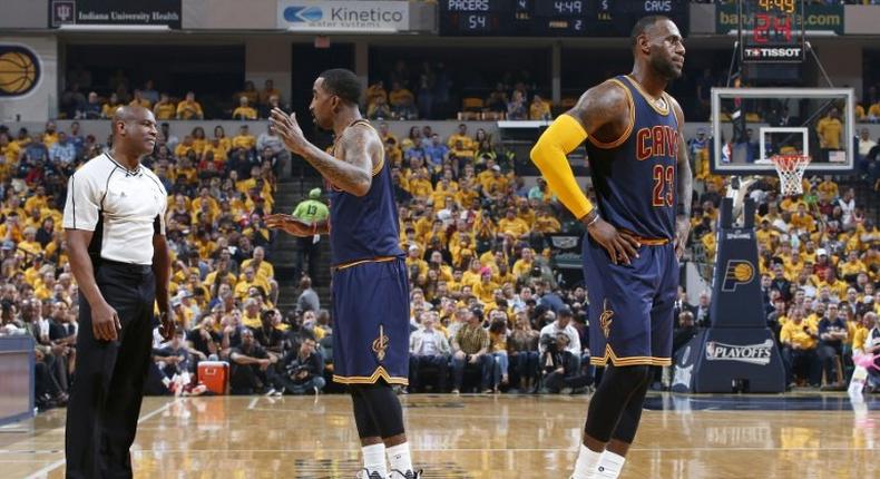 LeBron James of the Cleveland Cavaliers looks on as teammate JR Smith argues a foul call in Game Three of the Eastern Conference Quarterfinals against the Indiana Pacers on April 20, 2017