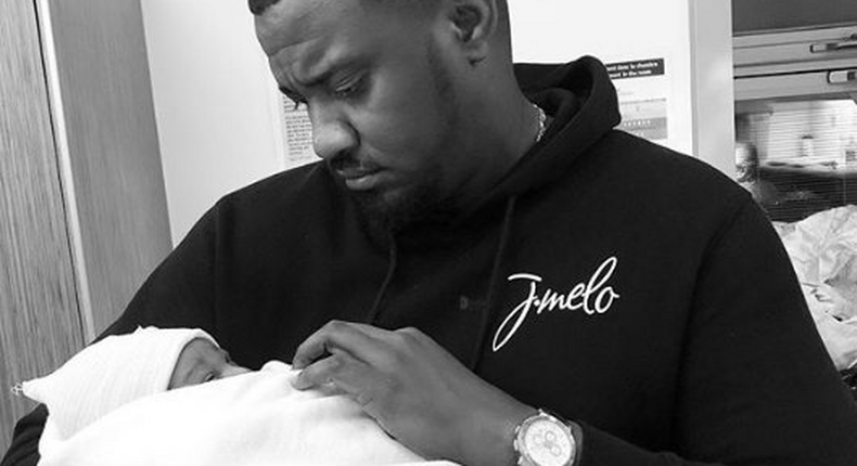 John Dumelo with his baby 