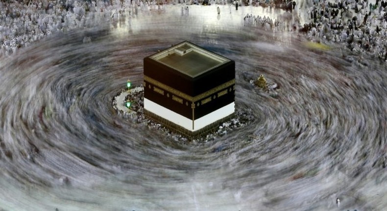 This long exposure photograph shows Muslim pilgrims circumambulating the Kaaba, Islam's holiest shrine, at the Grand Mosque in Saudi Arabia's holy city of Mecca on August 27, 2017, prior to the start of the annual Hajj pilgrimage