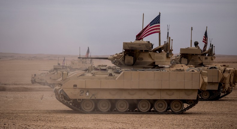 American soldiers fire from Bradley fighting vehicles during a joint exercise with Syrian Democratic Forces at the countryside of Deir Ezzor in northeastern Syria, Wednesday, Dec. 8, 2021.AP Photo/Baderkhan Ahmad