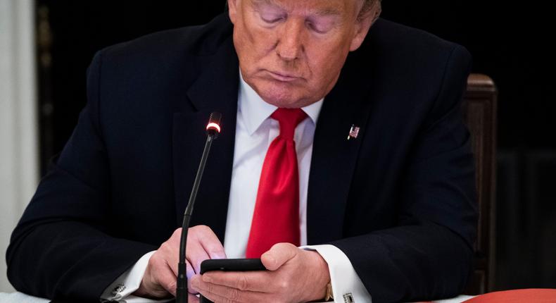 Then-President Donald Trump uses his cellphone at the White House on June 18, 2020.Jabin Botsford/The Washington Post via Getty Images