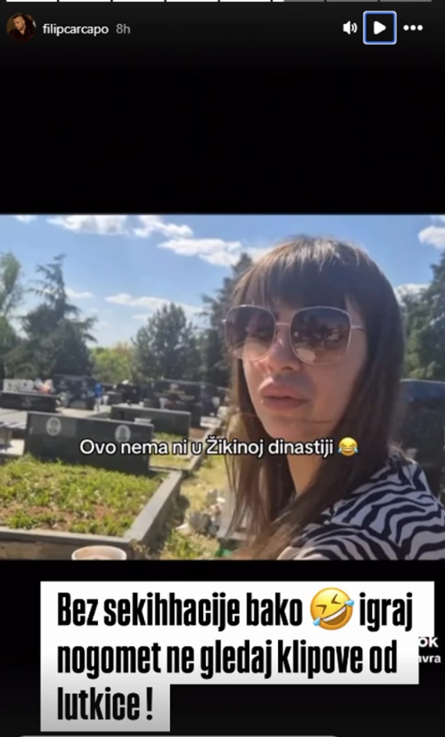 Miljana Kulić na babinom grobu 