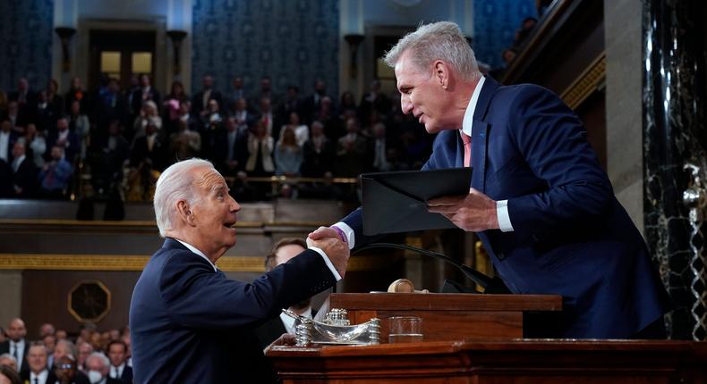 US President Joe Biden shakes hands as he presents a copy of his speech to House Speaker Kevin McCarthy of Calif., before he delivers his State of the Union address to a joint session of Congress, on February 7, 2023 in the House Chamber of the U.S. Capitol in Washington, DC.Jacquelyn Martin-Pool/Getty Images