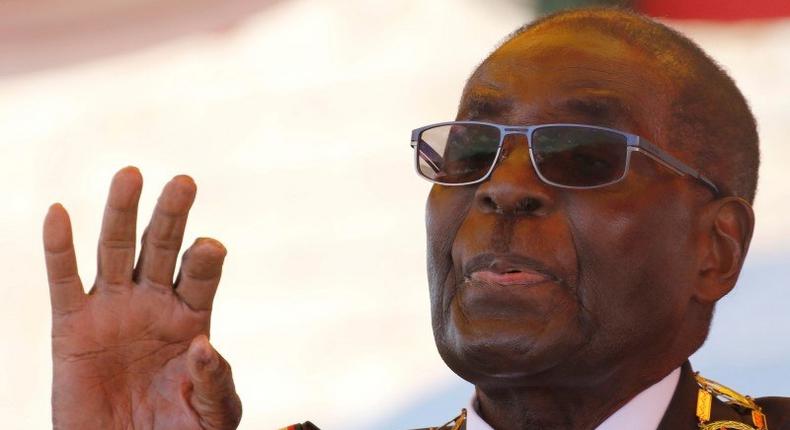 Zimbabwe's President Robert Mugabe gestures as he addresses a gathering in a speech to mark the National Heroes Day celebrations in the capital Harare, Zimbabwe August 8, 2016. REUTERS/Philimon Bulawayo