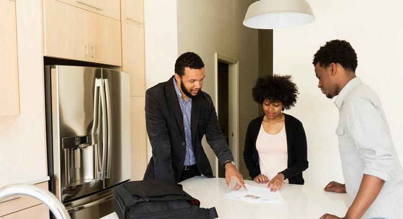 couple in new home signing paperwork