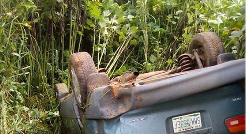 A car lying on its back after somersaulting.