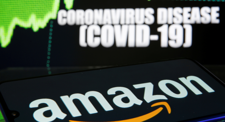 FILE PHOTO: Amazon logo is seen in front of diplayed coronavirus disease (COVID-19) in this illustration taken March 19, 2020. REUTERS/Dado Ruvic/Illustration/File Photo