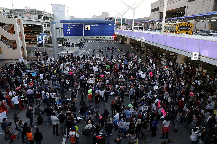 Protesters block a road during a demonstration against the immigration ban imposed by U.S. President Donald Trump at Los Angeles International Airport on January 29, 2017 in Los Angeles, California.