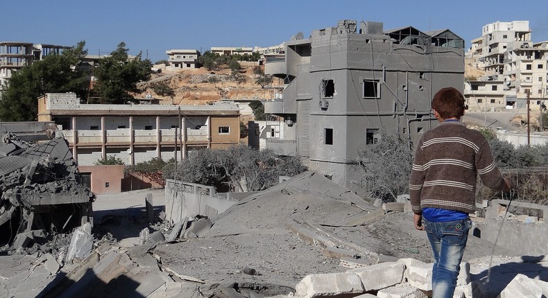 Debris are seen following a US-led coalition airstrike hits Headquarters of al Nusra Front in Aleppo, Syria on November 06, 2014.