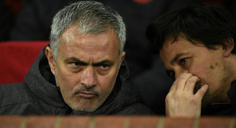 Jose Mourinho (L) talks with his assistant manager Rui Faria when the pair were at Man Utd