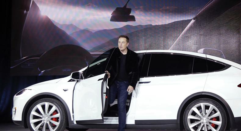 FILE - In this Sept. 29, 2015, file photo, Elon Musk, CEO of Tesla Motors Inc., introduces the Model X car at the company's headquarters in Fremont, Calif. Tesla Motors customers will get enhanced radar and other features in an over-the-air software update that starts Wednesday, Sept. 21, 2016. The update makes the Model S sedan and Model X SUV more reliant on radar than cameras when driving in Tesla's semi-autonomous Autopilot mode. Teslas made after October 2014 have radar. (AP Photo/Marcio Jose Sanchez, File)