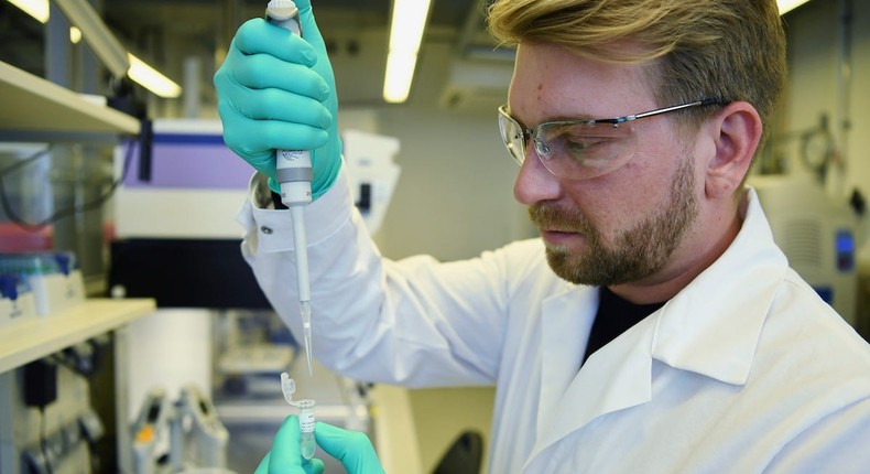 Employee Philipp Hoffmann, of German biopharmaceutical company CureVac, demonstrates research workflow on a vaccine for the coronavirus (COVID-19) disease at a laboratory in Tuebingen, Germany, March 12, 2020. Picture taken on March 12, 2020. REUTERS/Andreas Gebert