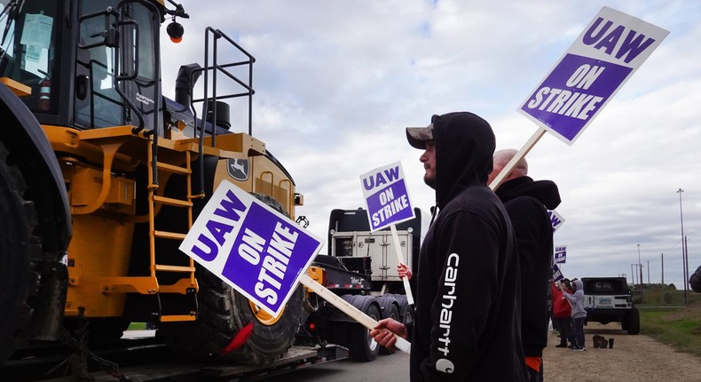 Striking John Deere workers sign a new contract following a month-long ...