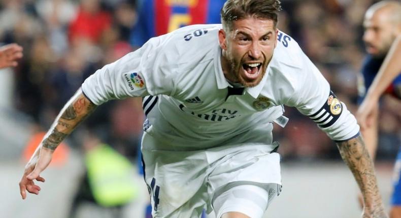 Real Madrid's defender Sergio Ramos celebrates after scoring a goal during the Spanish league football match FC Barcelona vs Real Madrid CF at the Camp Nou stadium in Barcelona on December 3, 2016