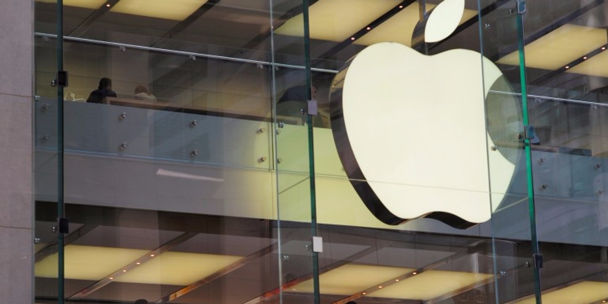 Customers and employees are shown through Apple's Australian flagship store in Sydney