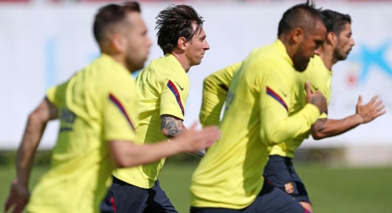 Ready for action: Lionel Messi and his Barcelona teammates are back in training