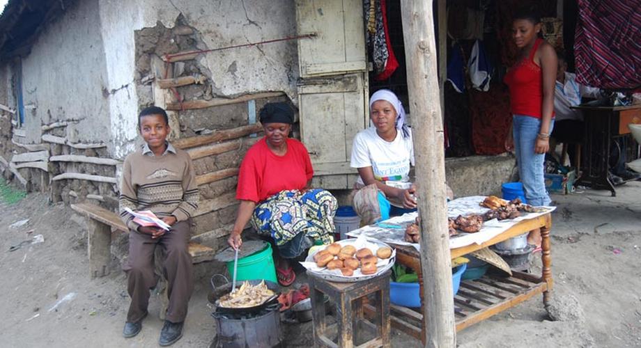Tanazania n woman cooking and selling bereal